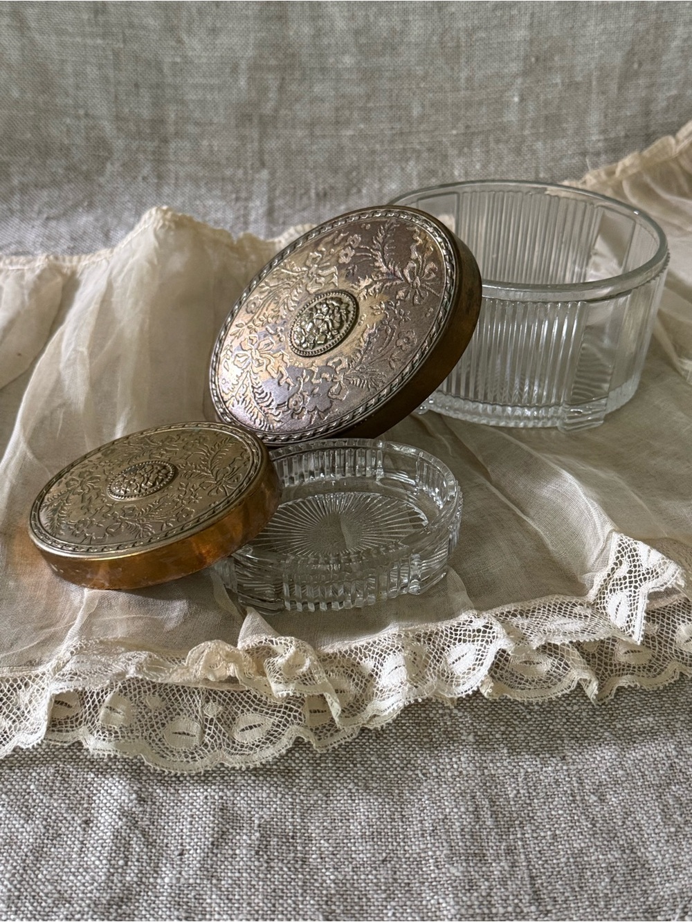 vintage Art Deco glass vanity powder jars with floral brass lids